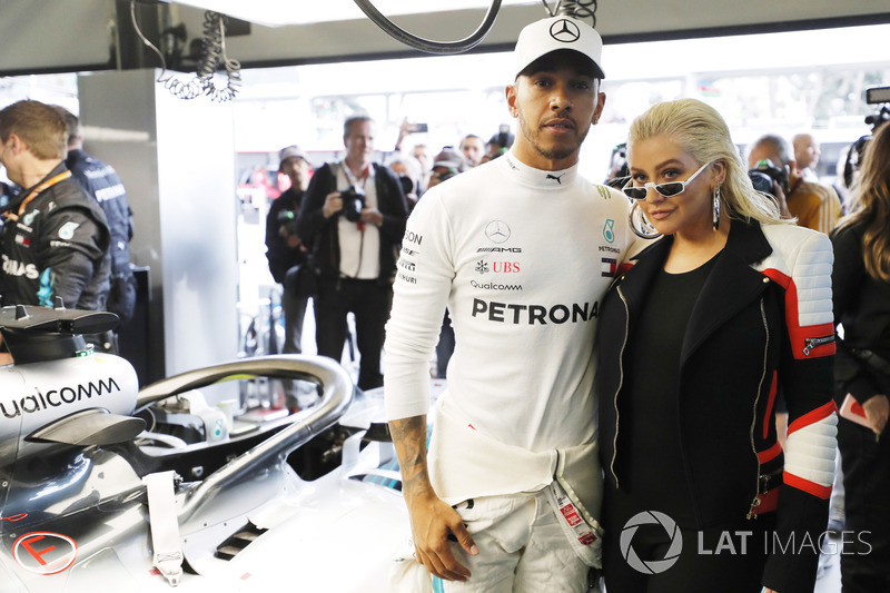 Lewis Hamilton, Mercedes AMG F1, in the garage with singer Christina Aguilera