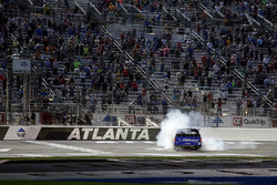 Brett Moffitt, Hattori Racing Enterprises, AISIN Atlanta Toyota Tundra celebrates with a burn out