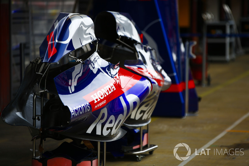 Bodywork belonging to the Toro Rosso STR13 cars in the pit lane