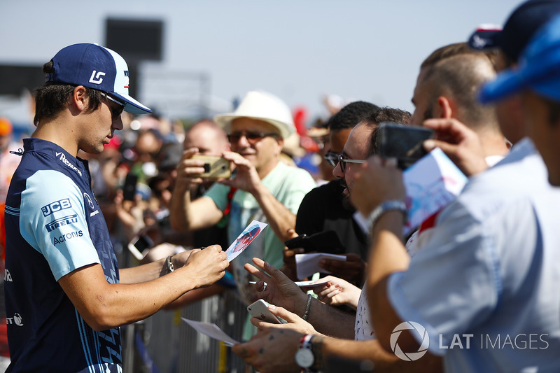 Lance Stroll, Williams Racing, signs autographs for fans