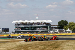 Max Verstappen, Red Bull Racing RB14, leads Daniel Ricciardo, Red Bull Racing RB14, and Kimi Raikkonen, Ferrari SF71H