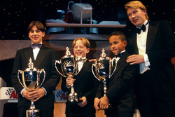 Mika Hakkinen presents to Gary Paffett, Tom Sisley and Lewis Hamilton