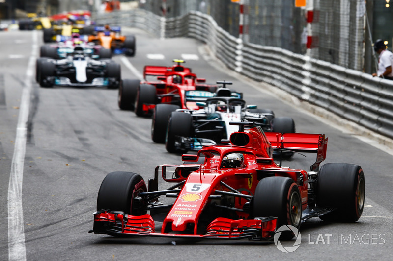 Sebastian Vettel, Ferrari SF71H, leads Lewis Hamilton, Mercedes AMG F1 W09, Kimi Raikkonen, Ferrari SF71H, Valtteri Bottas, Mercedes AMG F1 W09