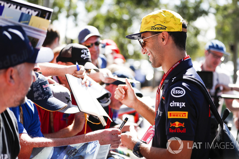 Daniel Ricciardo, Red Bull Racing, signs autographs for fans