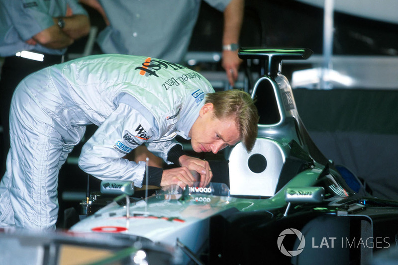 Race winner Mika Hakkinen,McLaren checks his cockpit