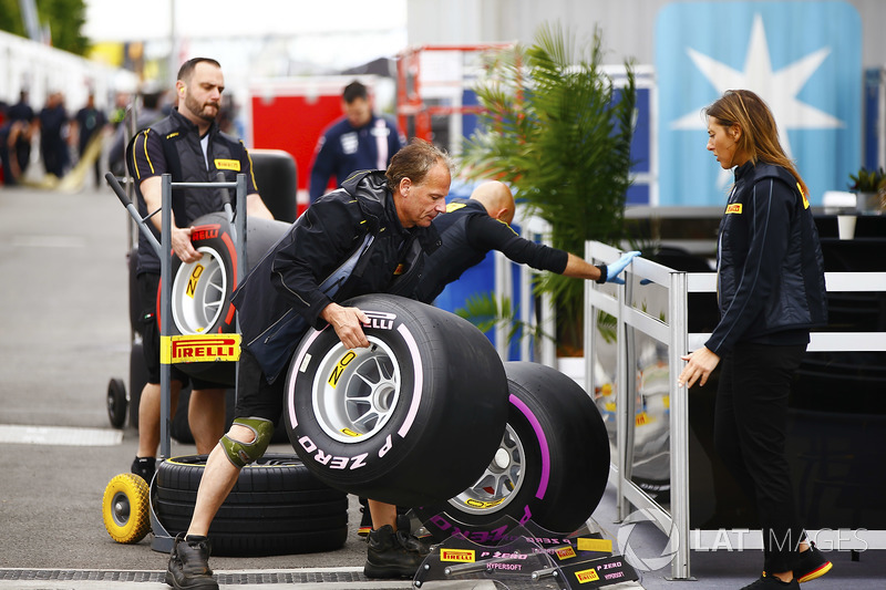 Pirelli personnel unload tyres in the paddock