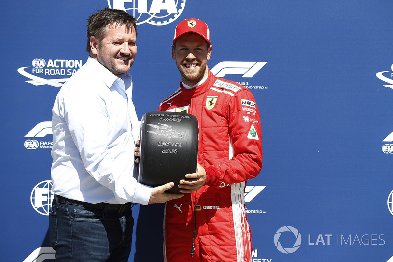 Paul Hembrey, Director, Pirelli Motorsport, presents Sebastian Vettel, Ferrari, with the Pirelli Pol