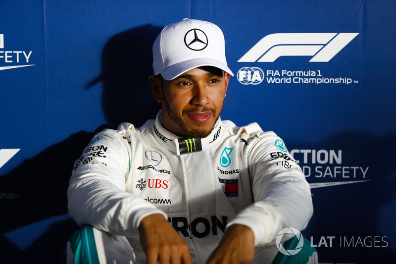 Lewis Hamilton, Mercedes AMG F1, relaxes after setting pole position