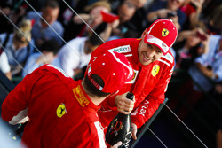 Race winner Sebastian Vettel, Ferrari, and thiod place Kimi Raikkonen, Ferrari celebrate on the podi