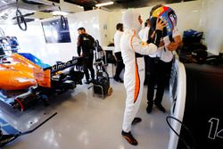 Fernando Alonso, McLaren, puts on his helmet in the team's garage