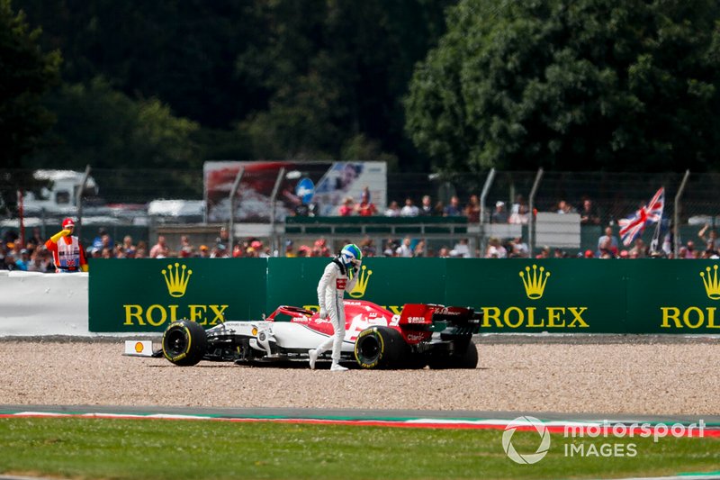 Antonio Giovinazzi, Alfa Romeo Racing C38, climbs out of his car after beaching it in a gravel trap
