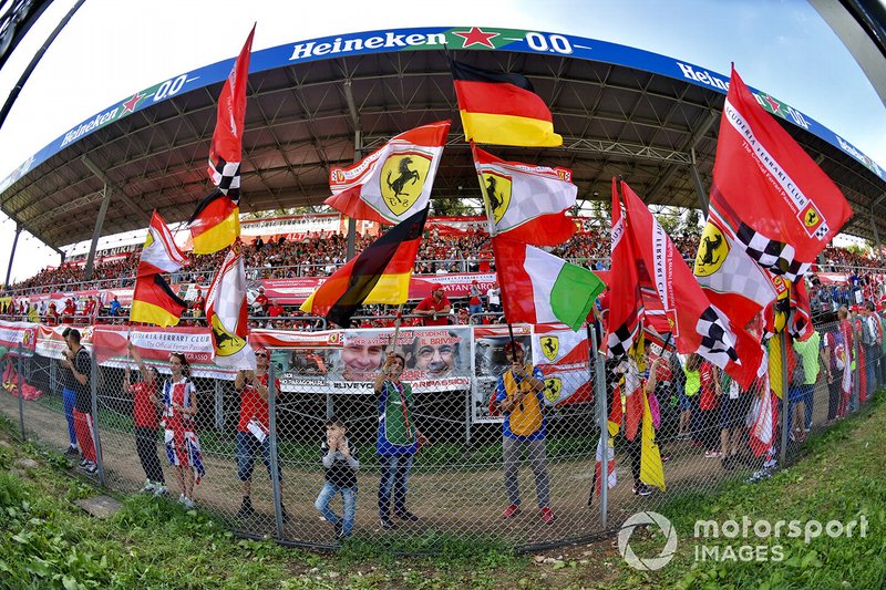 Ferrari fans wave their flags