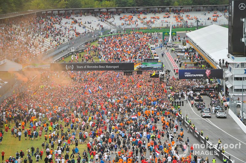Fans invade the circuit in celebration at the end of the race
