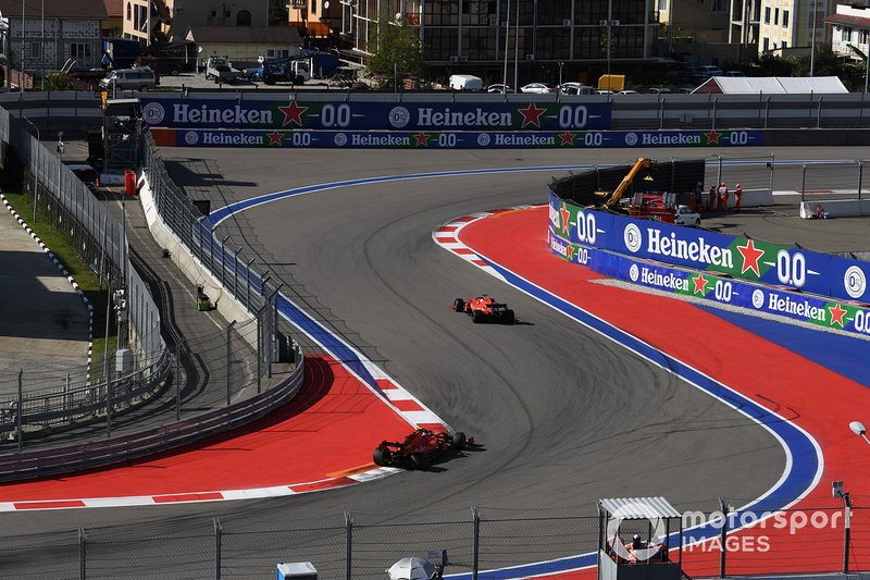 Sebastian Vettel, Ferrari SF90, leads Charles Leclerc, Ferrari SF90