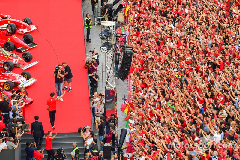 Charles Leclerc, Ferrari and Sebastian Vettel, Ferrari wave to the crowd as they take to the stage