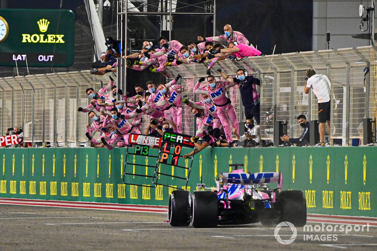 Sergio Perez, Racing Point RP20, crosses the finish line to take the race win