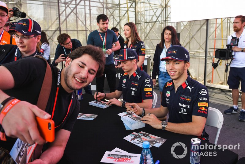 Pierre Gasly, Red Bull Racing takes a selfie with a fan and Max Verstappen, Red Bull Racing