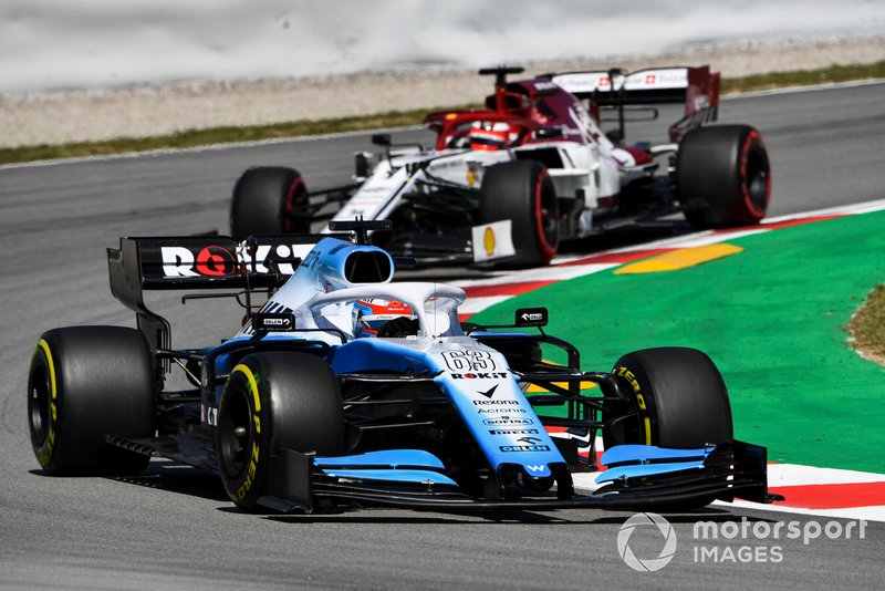 George Russell, Williams Racing FW42, leads Kimi Raikkonen, Alfa Romeo Racing C38