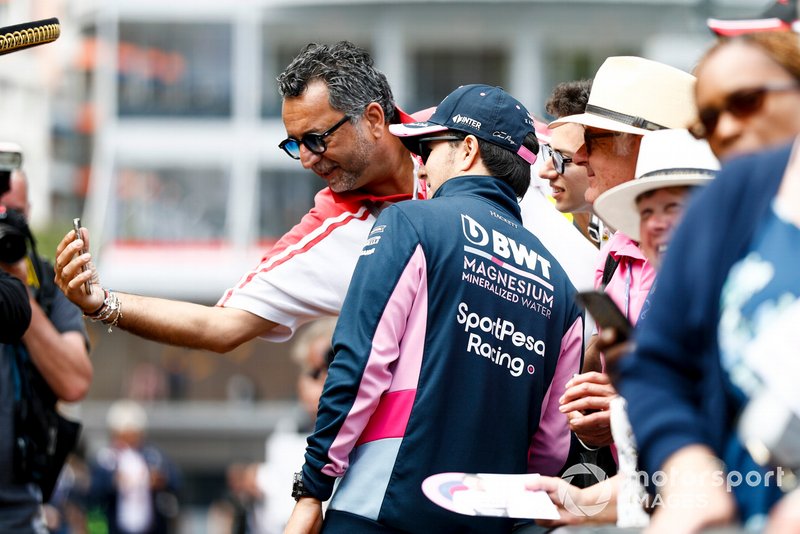 Sergio Perez, Racing Point poses for a selfie with a fan