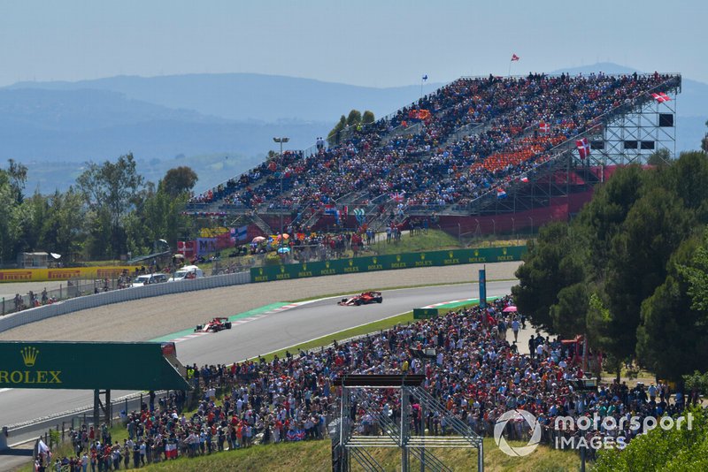 Sebastian Vettel, Ferrari SF90, leads Charles Leclerc, Ferrari SF90