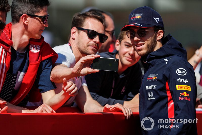 Pierre Gasly, Red Bull Racing poses for a selfie with a fan