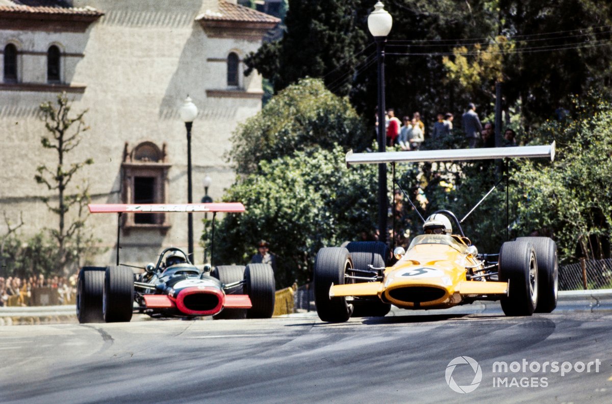 Denny Hulme, McLaren M7A Ford, leads Pedro Rodriguez, BRM P126