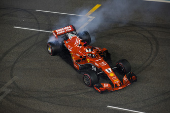 Sebastian Vettel, Ferrari, 2nd position, performs donuts on the grid at the end of the race