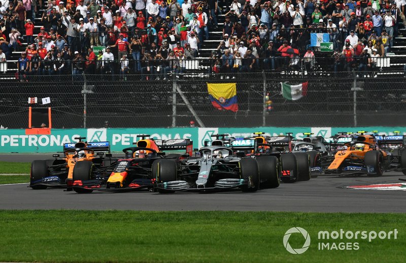 Lewis Hamilton, Mercedes AMG F1 W10, hits Max Verstappen, Red Bull Racing RB15
