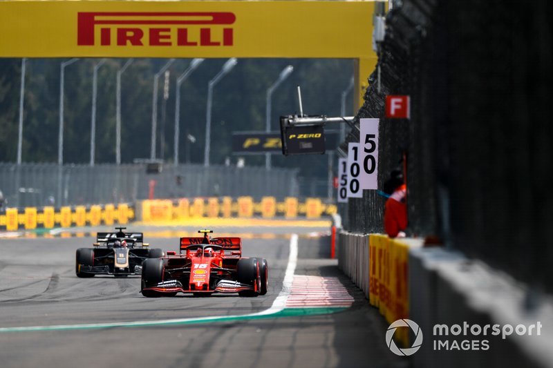 Charles Leclerc, Ferrari SF90, leads Romain Grosjean, Haas F1 Team VF-19