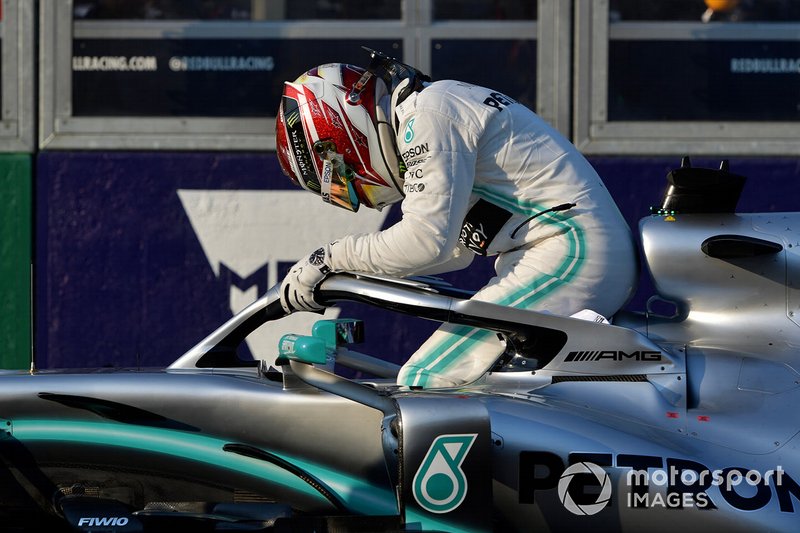 Lewis Hamilton, Mercedes AMG F1, climbs out of his car after securing pole position