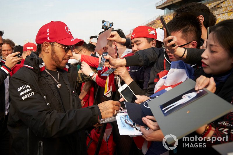 Lewis Hamilton, Mercedes AMG F1, signs autographs for fans