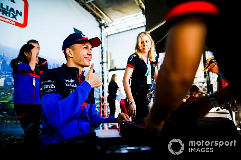 Alexander Albon, Toro Rosso signs autographs for fans