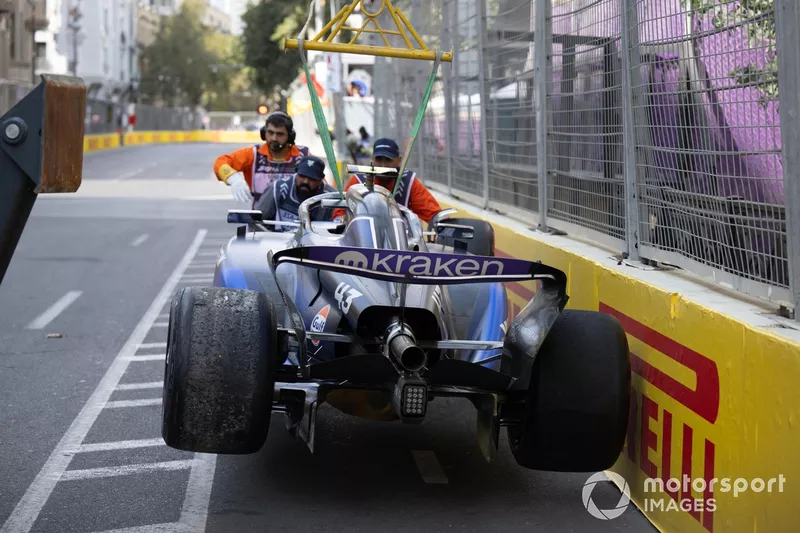 Marshals remove the damaged car of Franco Colapinto, Williams FW46, from the circuit
