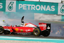 Sebastian Vettel, Ferrari SF16-H and Nico Rosberg, Mercedes AMG F1 W07 Hybrid collide at the start o
