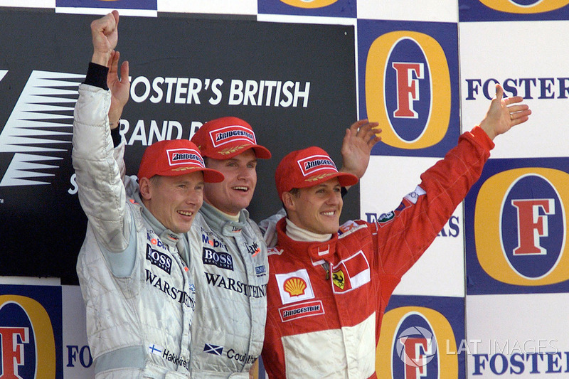 Podium: winnaar David Coulthard, McLaren, tweede Mika Hakkinen, McLaren, derde Michael Schumacher, F