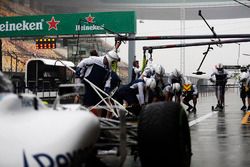 The Williams team makes a practice pit stop