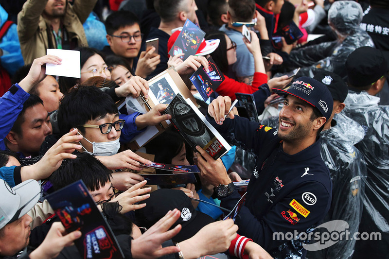 Daniel Ricciardo, Red Bull Racing, signs autographs for fans