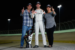 Champion Daniel Suarez, Joe Gibbs Racing Toyota and his parents Rosaline Garza and Alejandro Suarez