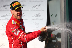 Podium: winner Sebastian Vettel, Ferrari celebrates with champagne