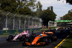 Fernando Alonso, McLaren MCL32, leads Esteban Ocon, Force India VJM10