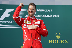 Sebastian Vettel, Ferrari, 1st Position, celebrates victory on the podium