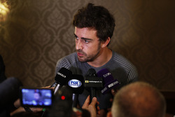 Fernando Alonso talks to the media after announcing his deal to race in the 2017 Indianapolis 500 in
