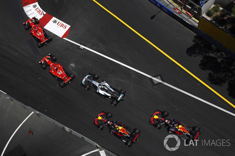 Kimi Raikkonen, Ferrari SF70H, Sebastian Vettel, Ferrari SF70H, Valtteri Bottas, Mercedes AMG F1 W08, at the start of the race