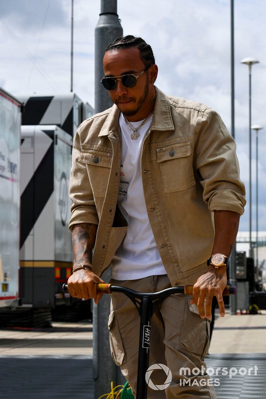 Lewis Hamilton, Mercedes AMG F1 on a scooter in the paddock
