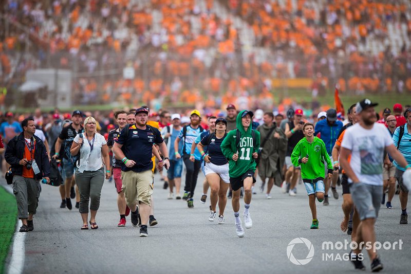 Fans invade the circuit to celebrate at the end of the race