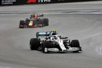 Valtteri Bottas, Mercedes AMG W10, leads Max Verstappen, Red Bull Racing RB15
