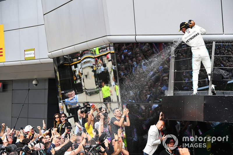 Lewis Hamilton, Mercedes AMG F1, 1st position, sprays Champagne from the podium