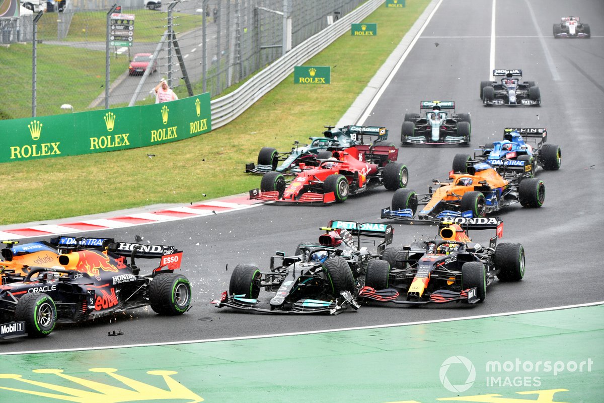 Valtteri Bottas, Mercedes W12, collides with Sergio Perez, Red Bull Racing RB16B, at the start