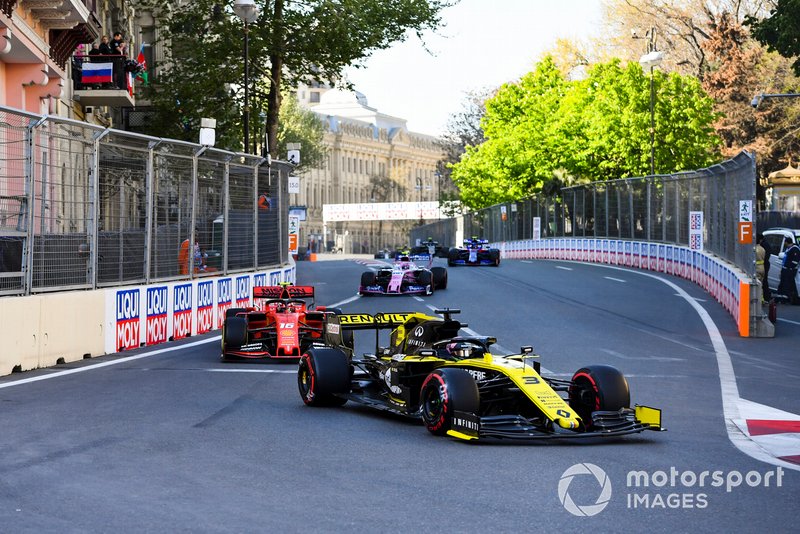Daniel Ricciardo, Renault R.S.19, leads Charles Leclerc, Ferrari SF90, and Lance Stroll, Racing Point RP19