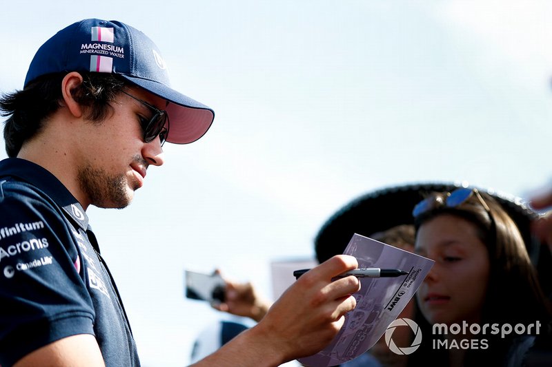 Lance Stroll, Racing Point signs a autograph for a fan